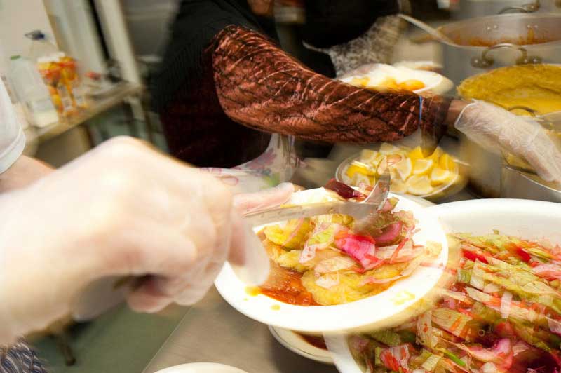 Who, me? Use a dirty trick like slow-sync flash to liven up an otherwise boring shot of someone serving food at a homeless shelter? Never!